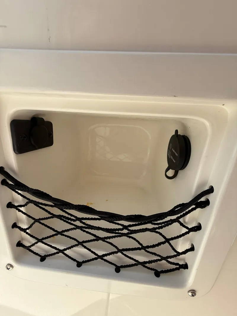 Slide: The Image of Storage compartment with netting in 2019 Bayliner VR4 Bowrider OB boat. - 16
