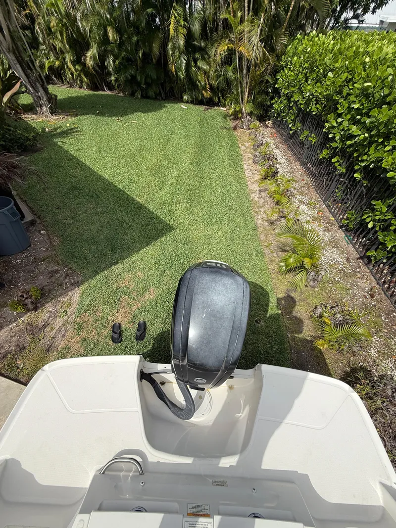 Slide: The Image of 2019 Bayliner VR4 Bowrider OB with outboard motor on grassy yard. - 18