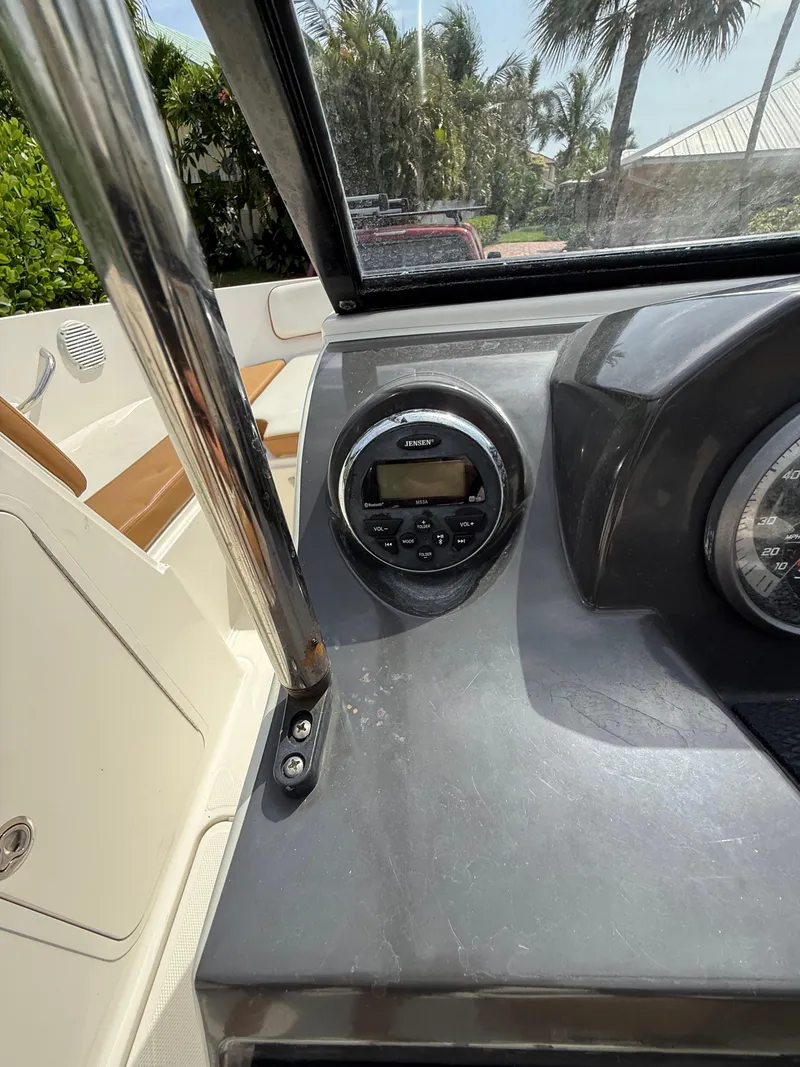 Slide: The Image of 2019 Bayliner VR4 Bowrider OB dashboard with Jensen audio system and speedometer. - 8