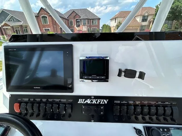 Slide: The Image of 2019 Blackfin 242 CC dashboard with Garmin display and control panel. - 11