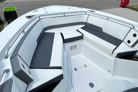 Slide: The Image of 2019 Blackfin 242 CC boat interior with cushioned seating and sleek design. - 20