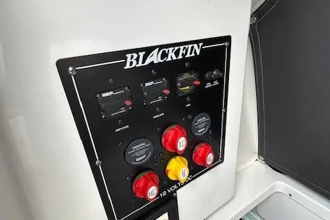 Slide: The Image of Control panel of 2019 Blackfin 242 CC boat with switches and dials. - 24