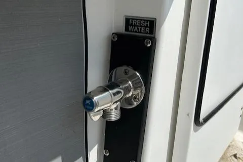 Slide: The Image of Fresh water outlet on 2019 Blackfin 242 CC boat. - 28