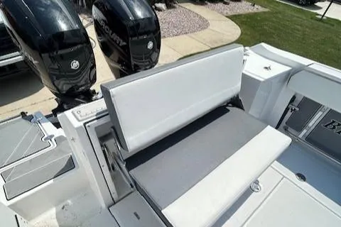 Slide: The Image of 2019 Blackfin 242 CC boat with dual Mercury engines and cushioned seating. - 7