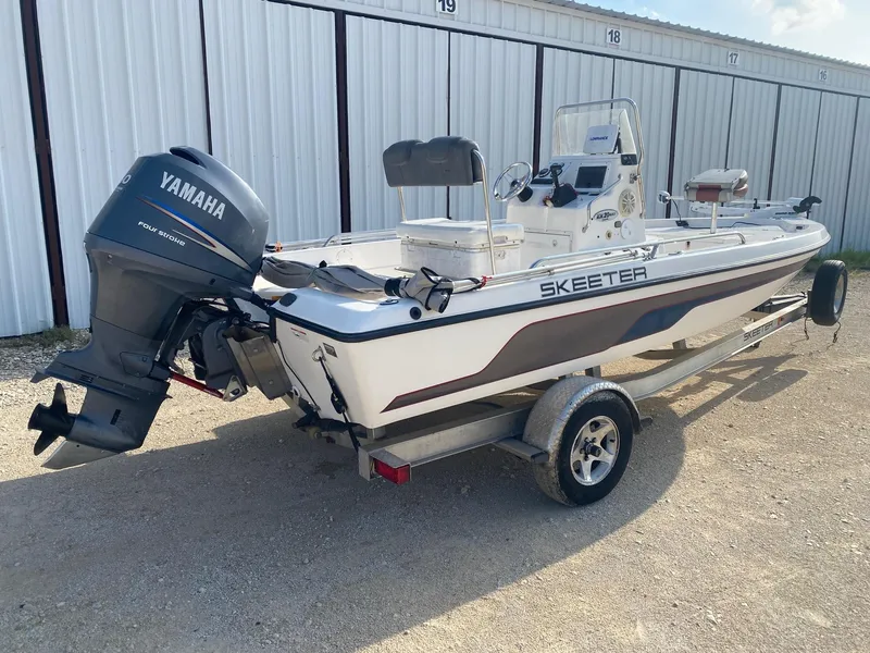 Slide: The Image of 2008 Skeeter ZX20 Bay boat with Yamaha engine on trailer, parked outdoors. - 5