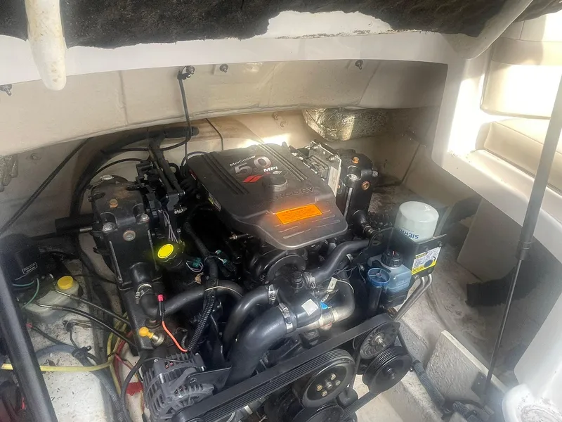 Slide: The Image of Engine compartment of a 2003 Chaparral 235 SSi boat, featuring a MerCruiser 5.0 MPI engine. - 15