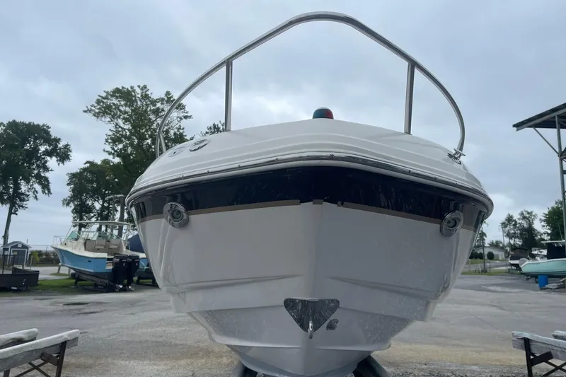 Slide: The Image of 2003 Chaparral 235 SSi boat on trailer, front view, overcast sky. - 2