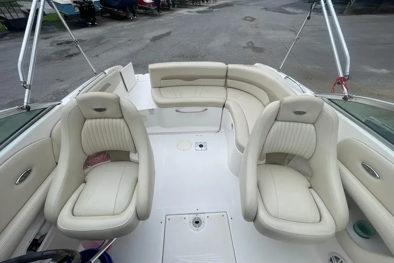 Slide: The Image of 2003 Chaparral 235 SSi boat interior with cream leather seating and spacious layout. - 7