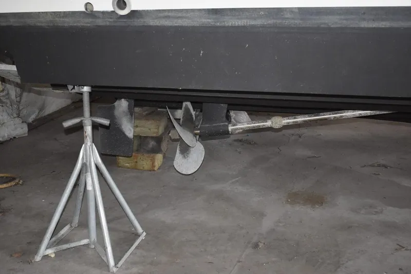 Slide: The Image of 2000 Cruisers Yachts 4450 Express Motoryacht propeller and hull on stands. - 11