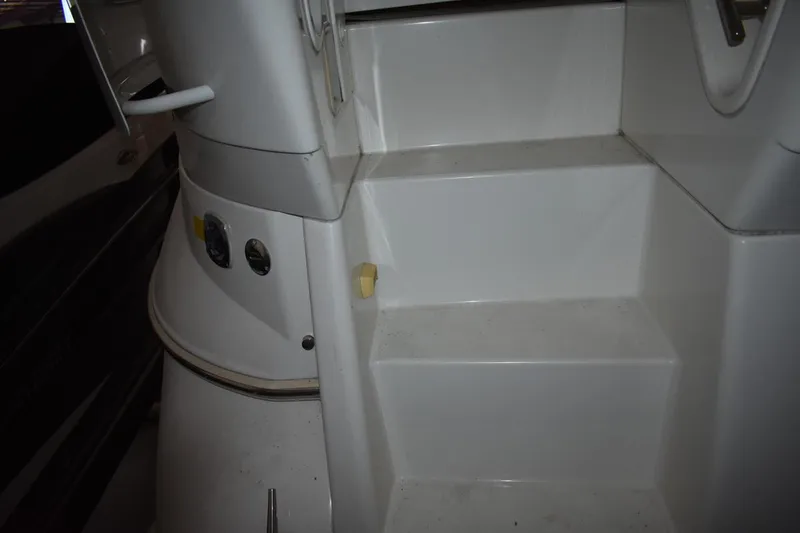 Slide: The Image of Staircase on 2000 Cruisers Yachts 4450 Express Motoryacht, featuring sleek white design. - 13
