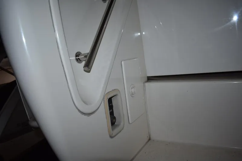 Slide: The Image of 2000 Cruisers Yachts 4450 Express Motoryacht interior detail with handrail and control panel. - 18