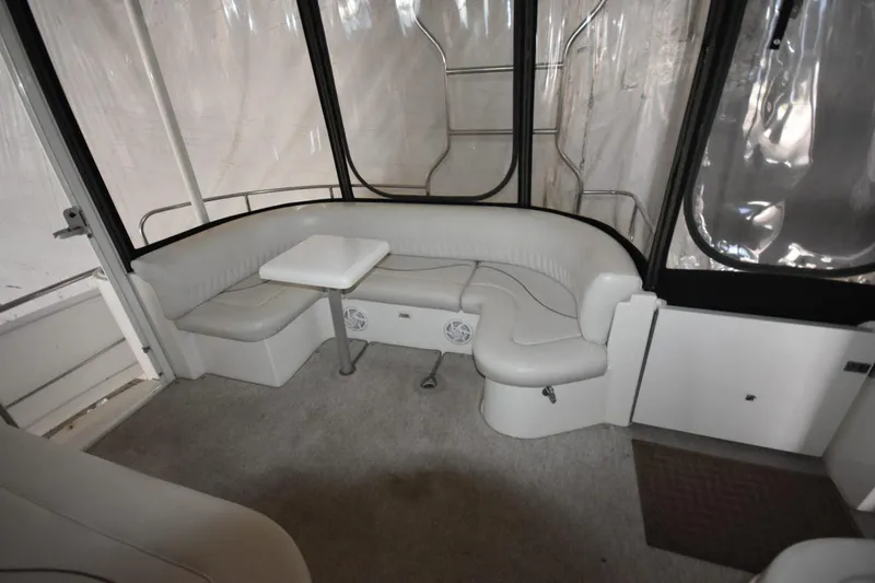 Slide: The Image of Interior of 2000 Cruisers Yachts 4450 Express Motoryacht with curved seating and table. - 19