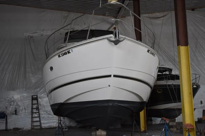 Slide: The Image of 2000 Cruisers Yachts 4450 Express Motoryacht in storage, front view. - 2