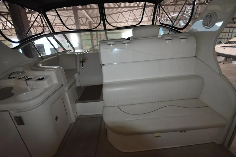 Slide: The Image of Interior of 2000 Cruisers Yachts 4450 Express Motoryacht with seating and kitchenette. - 20