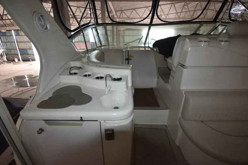 Slide: The Image of Interior of 2000 Cruisers Yachts 4450 Express Motoryacht with seating and sink area. - 23
