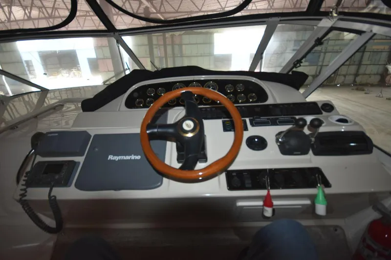 Slide: The Image of Helm of 2000 Cruisers Yachts 4450 Express Motoryacht with Raymarine navigation system. - 25
