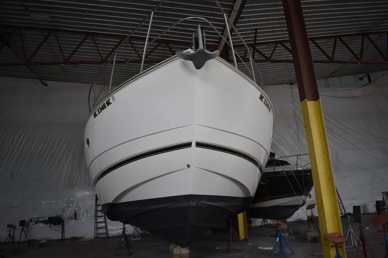 Slide: The Image of 2000 Cruisers Yachts 4450 Express Motoryacht in storage, viewed from the front. - 3