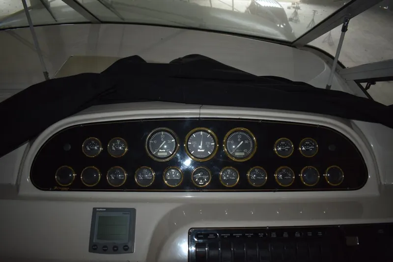 Slide: The Image of Dashboard of 2000 Cruisers Yachts 4450 Express Motoryacht with gauges and controls. - 32