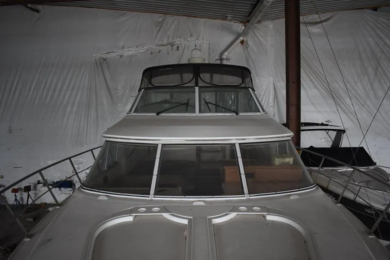 Slide: The Image of 2000 Cruisers Yachts 4450 Express Motoryacht in storage, front view. - 34