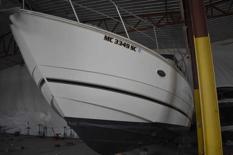 Slide: The Image of 2000 Cruisers Yachts 4450 Express Motoryacht in storage, side view. - 4