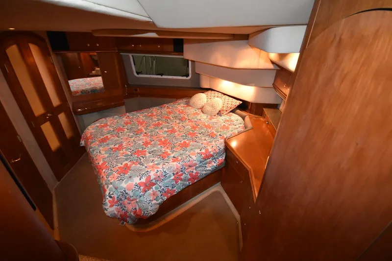 Slide: The Image of Luxurious bedroom in 2000 Cruisers Yachts 4450 Express Motoryacht with floral bedding. - 47