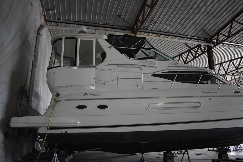 Slide: The Image of 2000 Cruisers Yachts 4450 Express Motoryacht in storage, side view. - 5