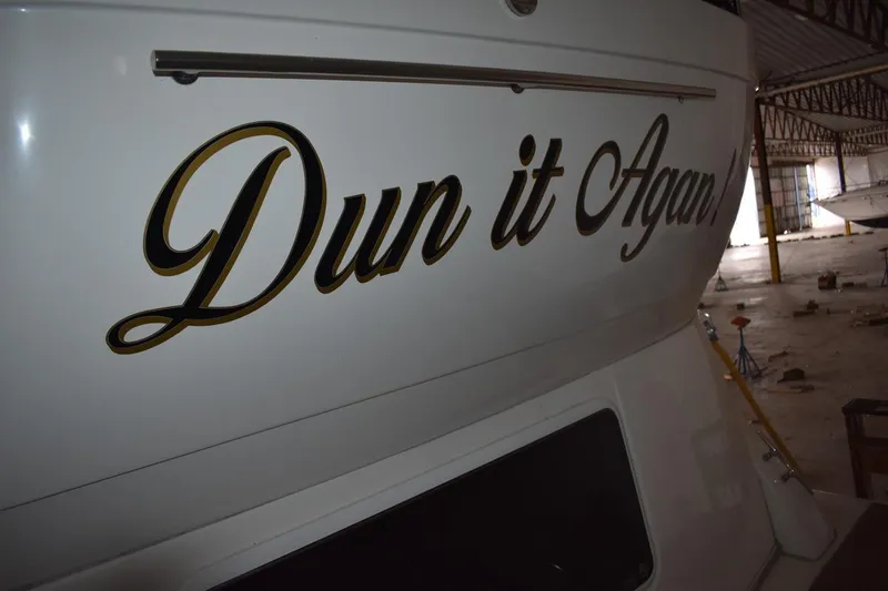Slide: The Image of 2000 Cruisers Yachts 4450 Express Motoryacht with "Dun it Again" name in storage. - 9