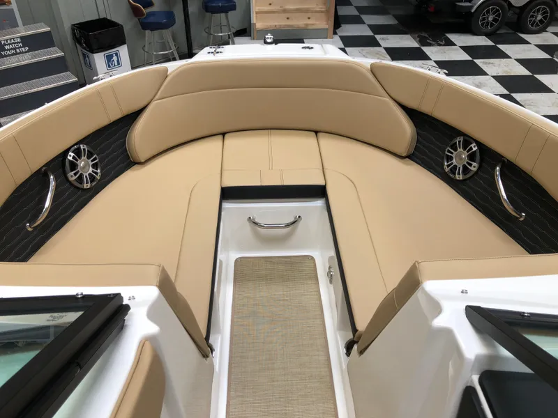 Slide: The Image of Interior view of 2025 Sea Ray SPX 230 boat with tan seating and modern design. - 7