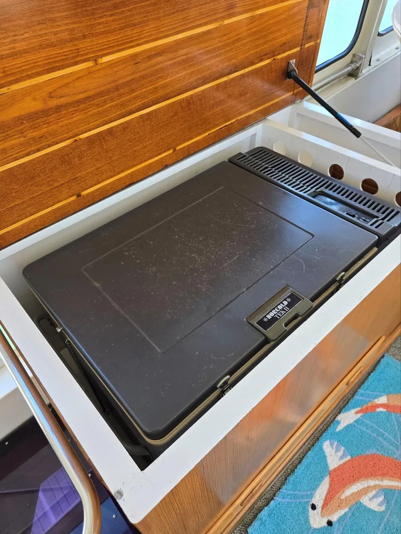 Slide: The Image of 1983 Ocean Alexander 43 Flush Aft Deck interior with built-in freezer - 25