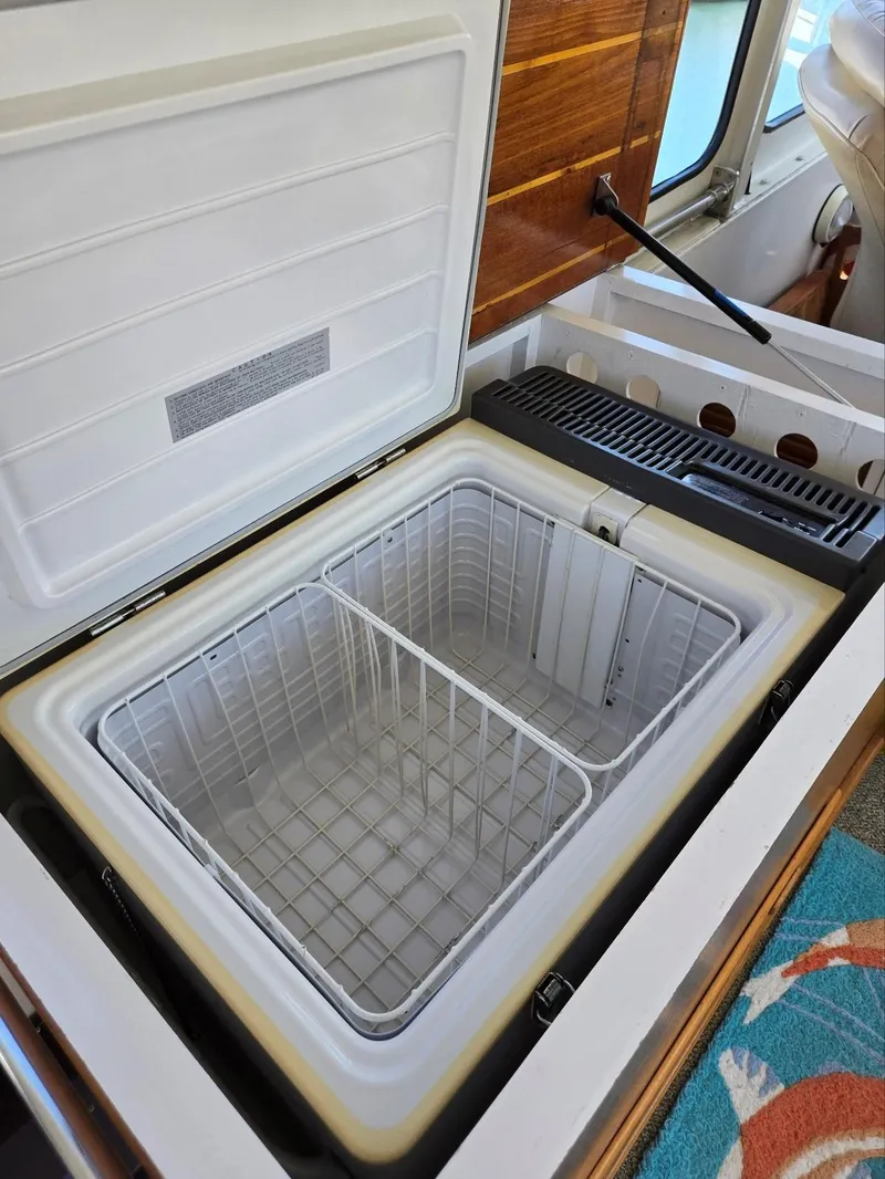 Slide: The Image of Open freezer compartment on 1983 Ocean Alexander 43 Flush Aft Deck yacht. - 26