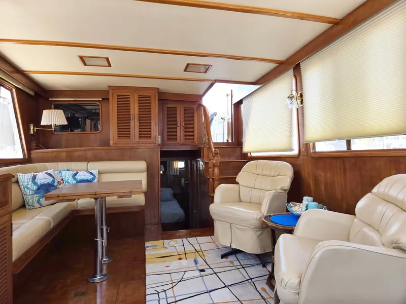 Slide: The Image of Luxurious 1983 Ocean Alexander 43 yacht interior with plush seating and elegant wood finishes. - 34