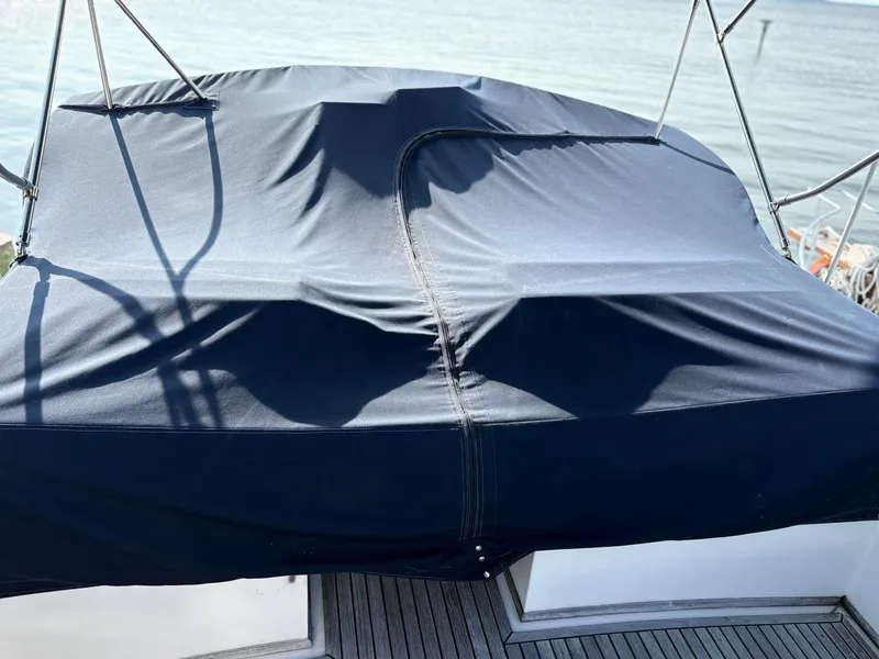 Slide: The Image of Covered deck of a 1986 Grand Banks 36 Classic boat with ocean view. - 4