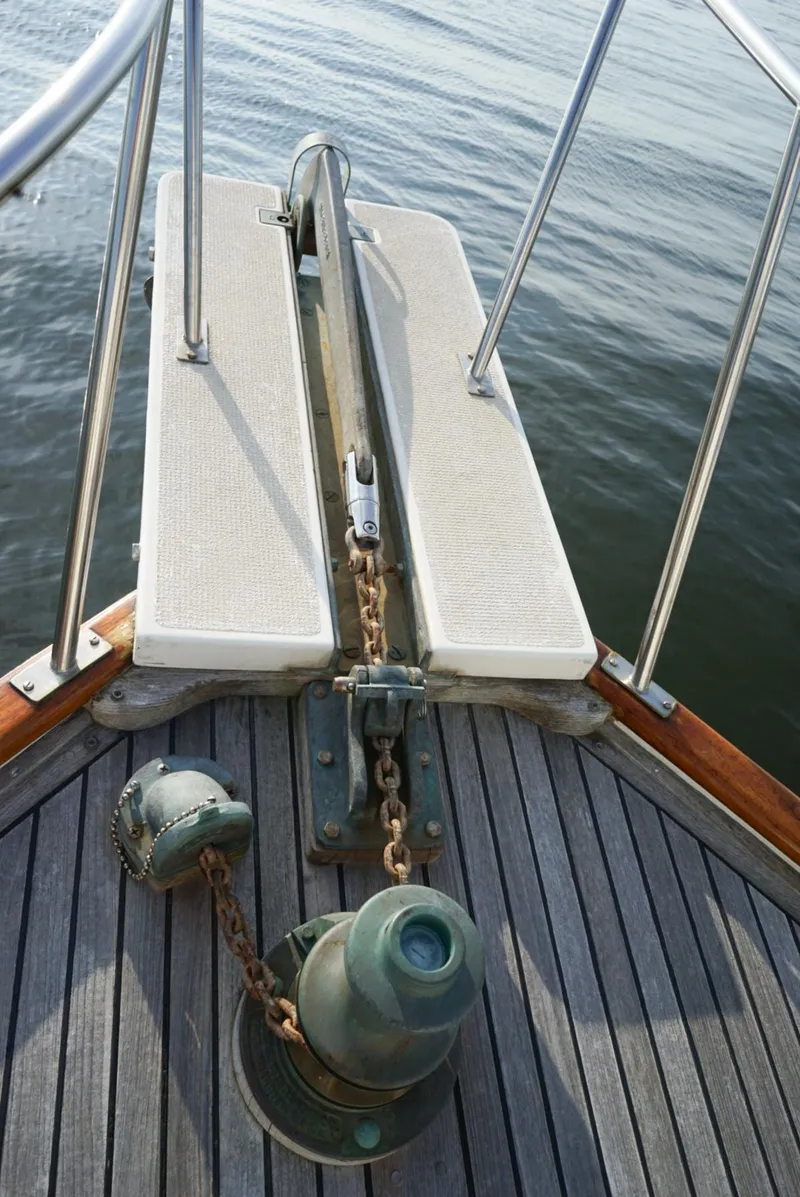 Slide: The Image of Bow of 1986 Grand Banks 36 Classic yacht with anchor chain and deck details. - 6