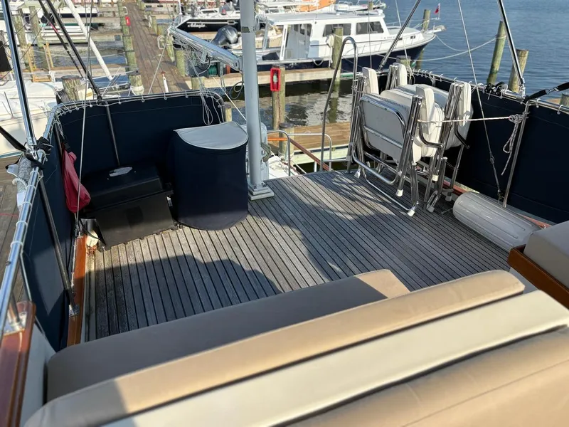 Slide: The Image of Flybridge of 1986 Grand Banks 36 Classic yacht with seating and marina view. - 8