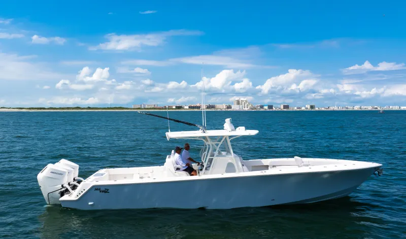 The Image of 2024 SeaVee Open Fisherman 390Z boat cruising on blue ocean waters. - 0