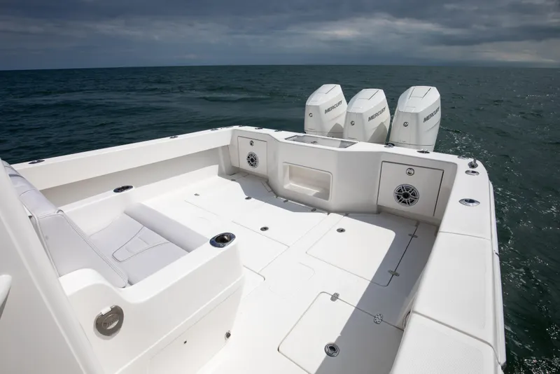 Slide: The Image of 2024 SeaVee Open Fisherman 390Z boat with triple Mercury engines on open sea. - 12