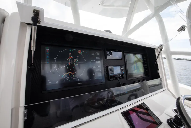 Slide: The Image of 2024 SeaVee Open Fisherman 390Z dashboard with advanced navigation and radar systems. - 19