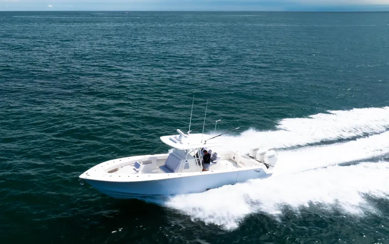 Slide: The Image of 2024 SeaVee Open Fisherman 390Z cruising on open ocean waters. - 2