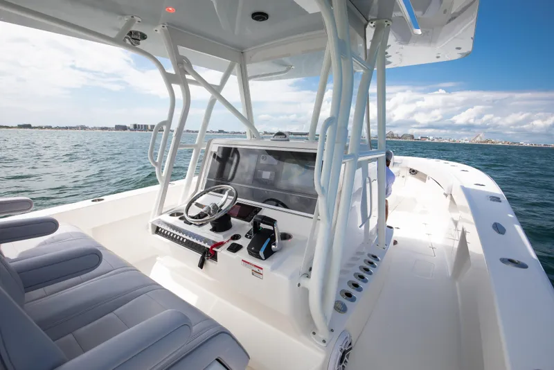 Slide: The Image of 2024 SeaVee Open Fisherman 390Z boat on water, featuring modern helm and seating. - 22