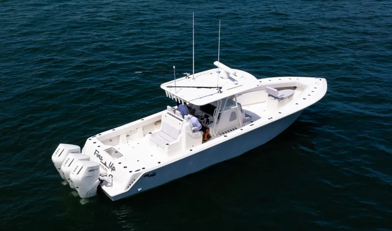 Slide: The Image of 2024 SeaVee Open Fisherman 390Z boat on water, featuring twin outboard engines. - 3