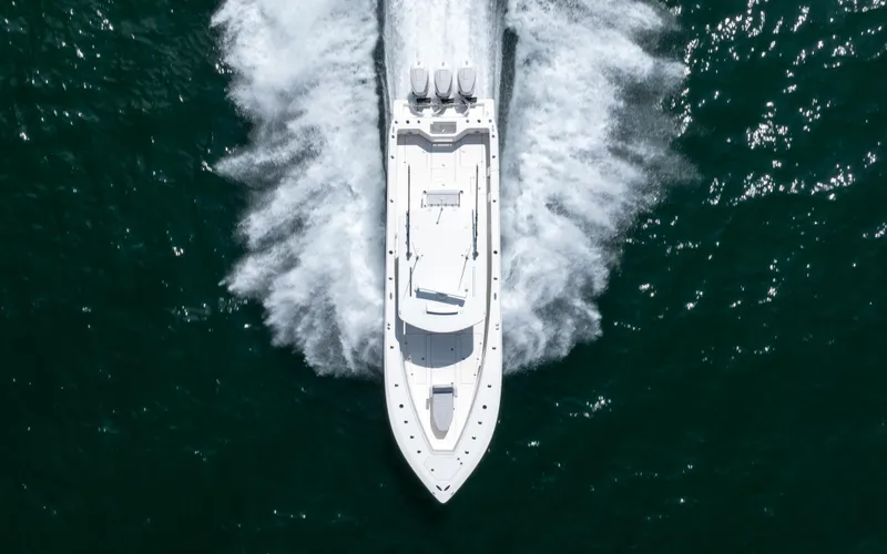 Slide: The Image of 2024 SeaVee Open Fisherman 390Z speeding on water, aerial view. - 6