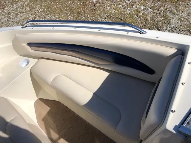 Slide: The Image of 2001 Stingray 180 LS/LX boat interior with beige seating and sleek design. - 13