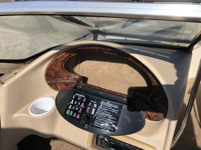 Slide: The Image of 2001 Stingray 180 LS/LX boat dashboard with control panel and windshield. - 20
