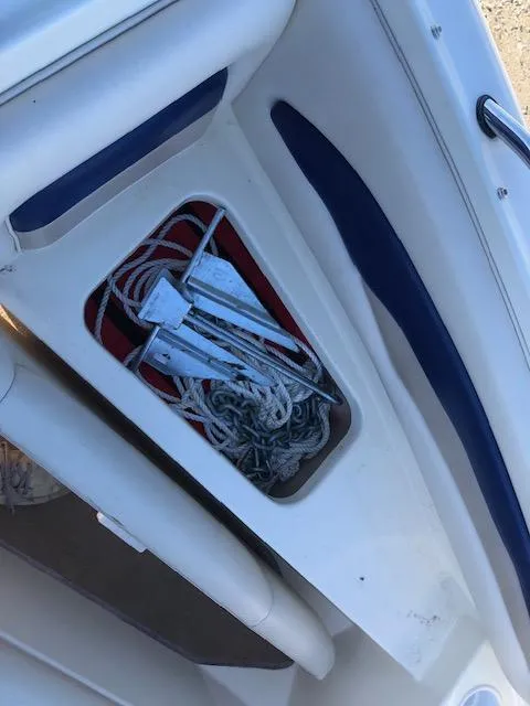 Slide: The Image of Storage compartment on a 2001 Stingray 180 LS/LX boat with ropes and anchors. - 22