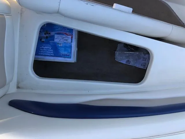 Slide: The Image of Stingray 180 LS/LX 2001 boat interior with storage compartment and blue trim. - 23