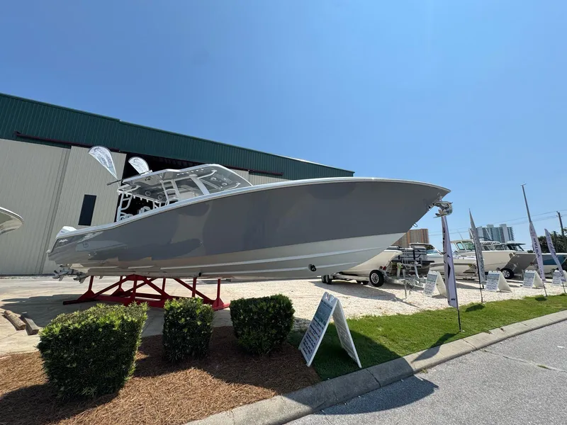 The Image of 2026 Invincible 43 Open Fisherman boat displayed outdoors on a sunny day. - 1