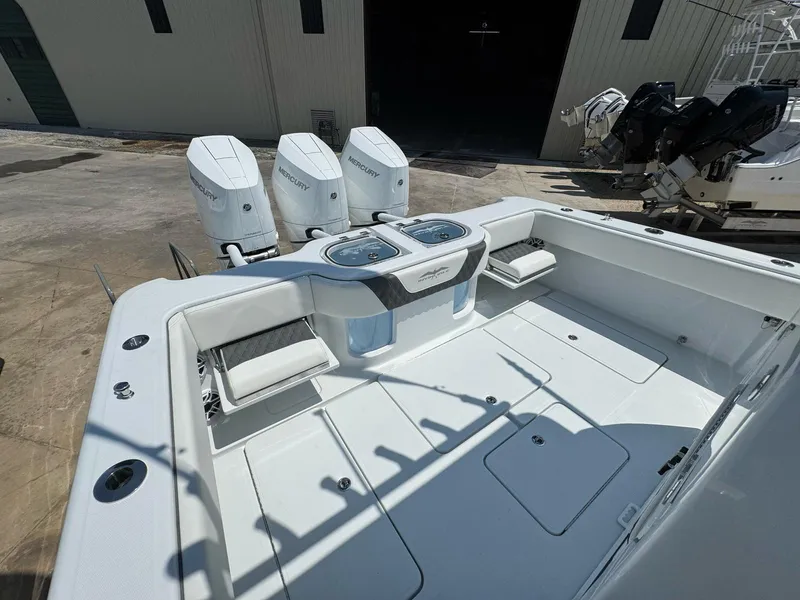 Slide: The Image of 2026 Invincible 43 Open Fisherman boat with triple Mercury engines, spacious deck. - 12