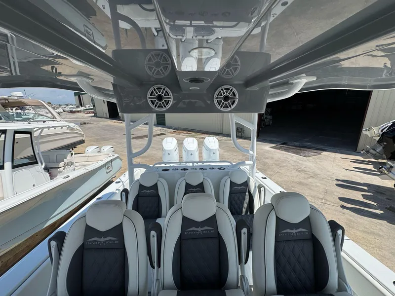 Slide: The Image of 2026 Invincible 43 Open Fisherman boat interior with luxury seating and modern design. - 15