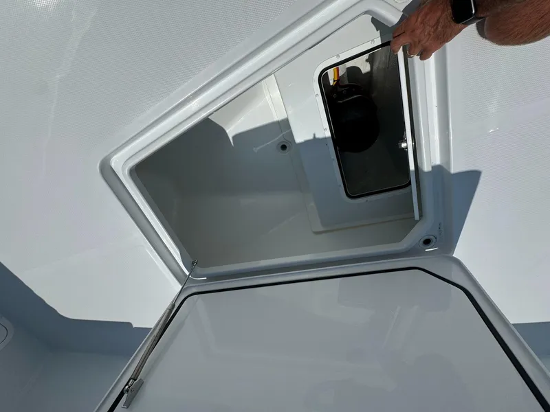 Slide: The Image of Open storage compartment on 2026 Invincible 43 Open Fisherman boat. - 26