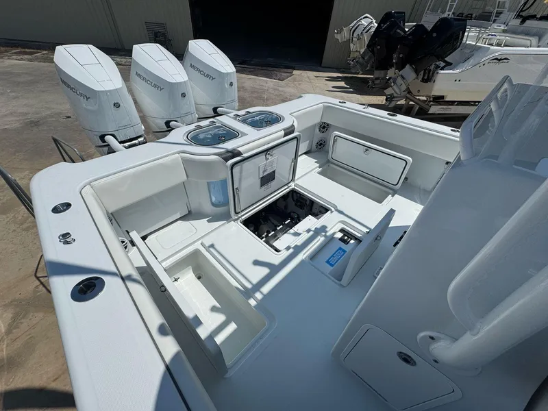 Slide: The Image of 2026 Invincible 43 Open Fisherman boat with Mercury engines, featuring spacious deck and storage compartments. - 36